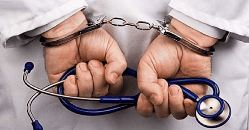 doctors hands handcuffed